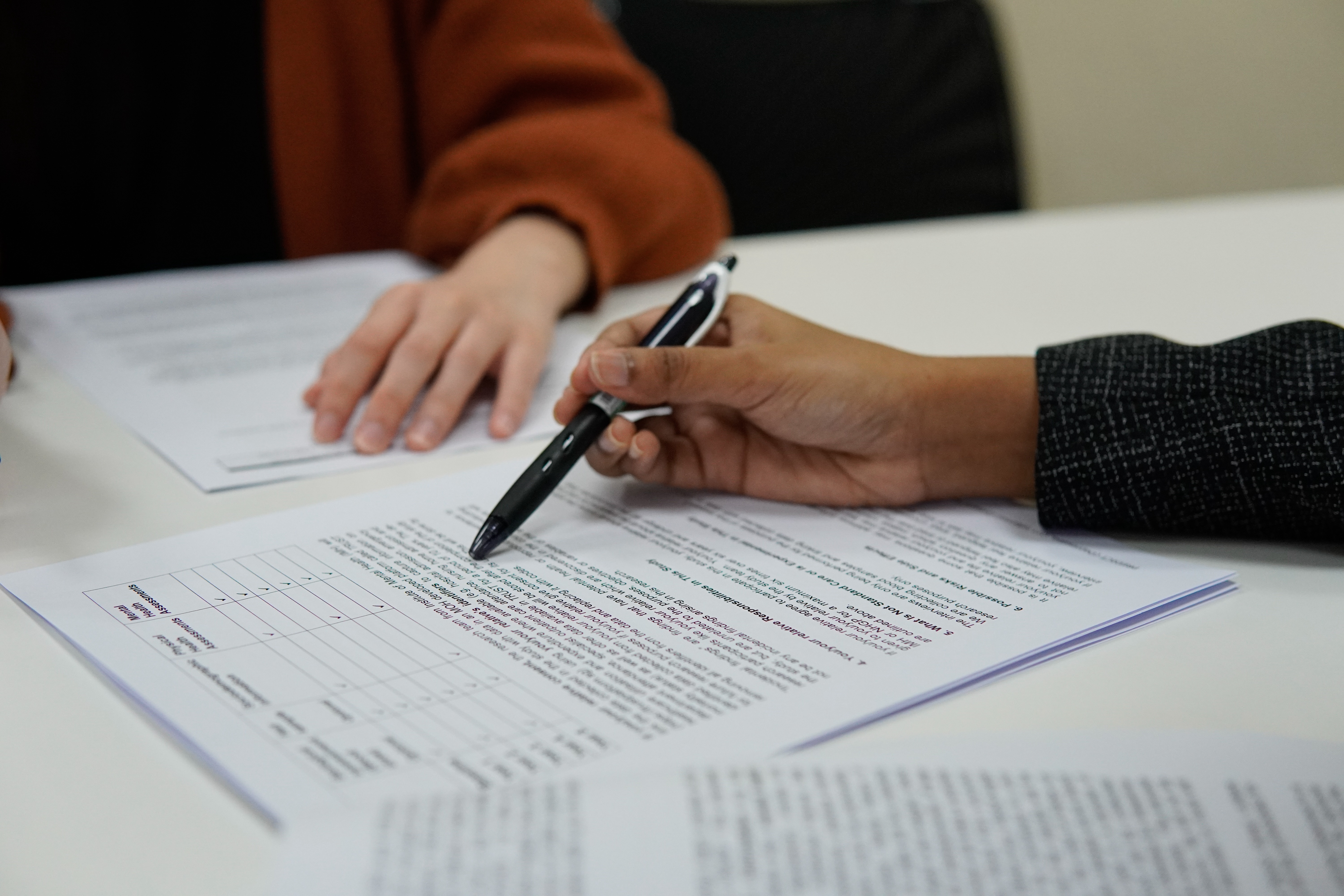 Two people looking over papers